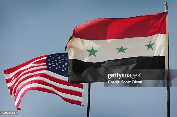 Iraqi and U.S. Flags fly over Al Asad air base August 29, 2005 in Al Asad, Iraq. The base is used as a major deplyment hub for Marines and Soldiers...