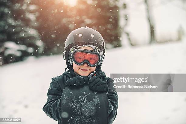 boy posing with his snowboard - snowboard day 6 foto e immagini stock