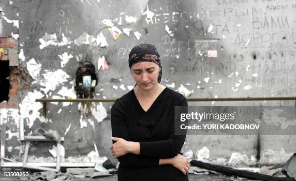 Beslan, RUSSIAN FEDERATION: Ludmila Dzgyeva who lost a daughter during the Beslan hostage drama in the town of Beslan 03 September 2004 stands in the...