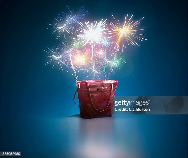 fireworks ascending from tote bag - multi colored purse ストックフォトと画像