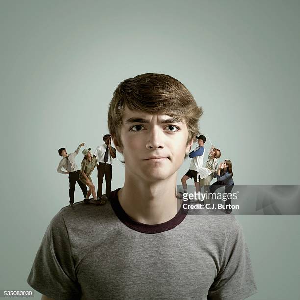 people giving advice to young man - expression stress stockfoto's en -beelden
