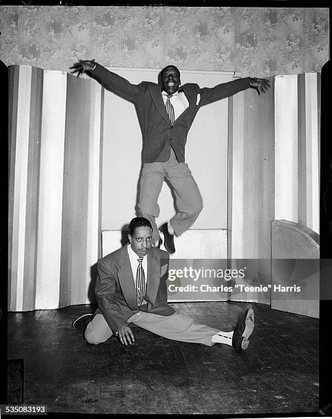 Eddie Jefferson jumping, and Irvin Taylor doing half split, in Harris Studio, Pittsburgh, Pennsylvania, 1941.