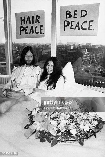 John Lennon and his wife Yoko Ono, relax in their hotel suite in Toronto in this May 26, 1969 file photo. The Lennons have been going around the...