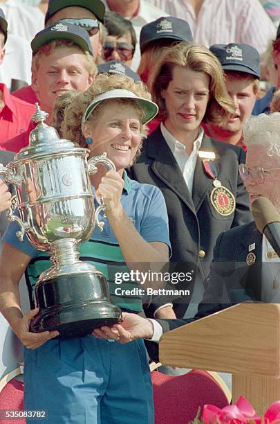 Lake Orion, Michigan- Betsy King holds the US Woman Open Championship trophy after winning the event by four strokes and six under par, 7/16.