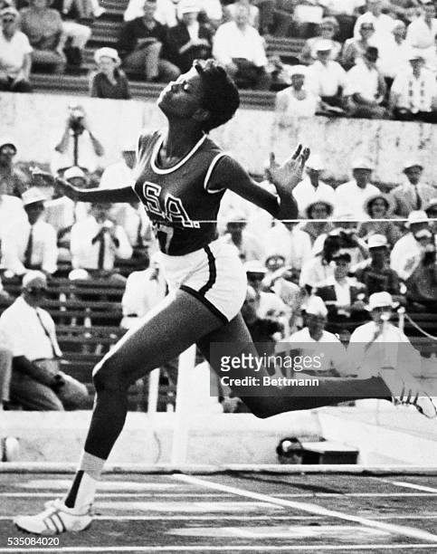 Rome, Italy- America's Wilma Rudolph, of Clarksville, TN, breaks the tape to win her semi-final heat in the women's 100-meter dash. Wilma won in the...