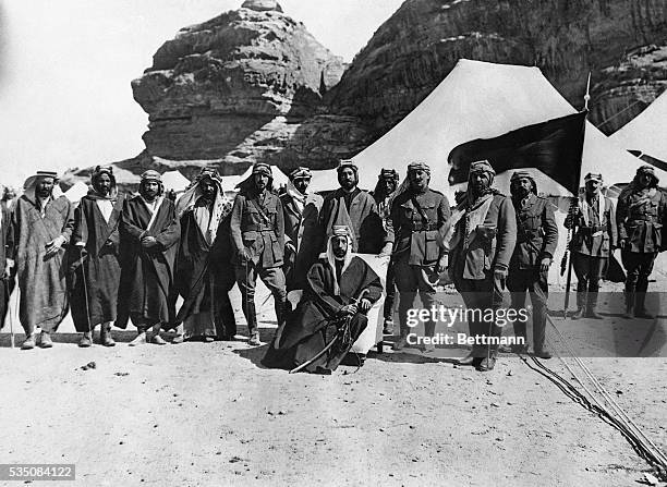 King Faisal of Iraq is shown above with his advisers on European affairs. The King of Iraq is a son of King Hussein of Hedjaz, who three years ago...