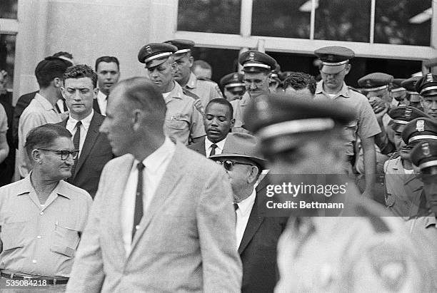 Jackson, MS- : Flanked by a horde of Mississippi Highway Patrolman, James Meredith is escorted away from State Building where his bid to enroll in...