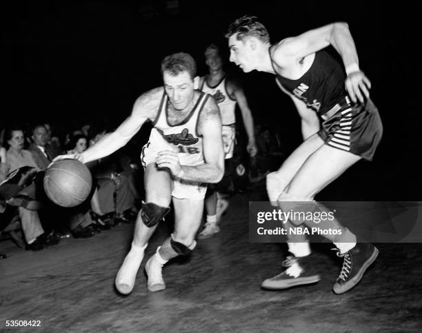 Red Holzman of the Rochester Royals drives to the basket during an NBA game circa 1950 in Rochester, New York. NOTE TO USER: User expressly...