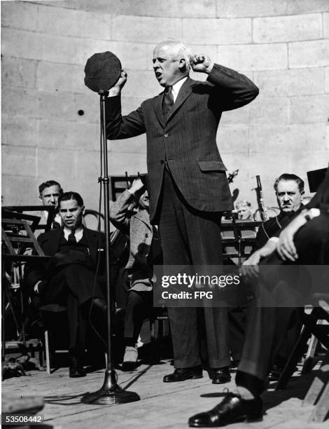 American socialist leader and pacifist Norman Thomas addresses the crowd at a May Day celebration held at the Mall in Central Park, New York, New...