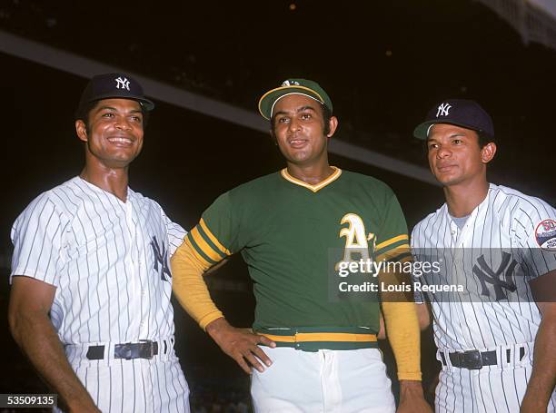 The Alou brothers, from left to right, Felipe Alou of the New York Yankees, Jesus Alou of the Oakland Athletics and Matty Alou of the Yankkes poses...