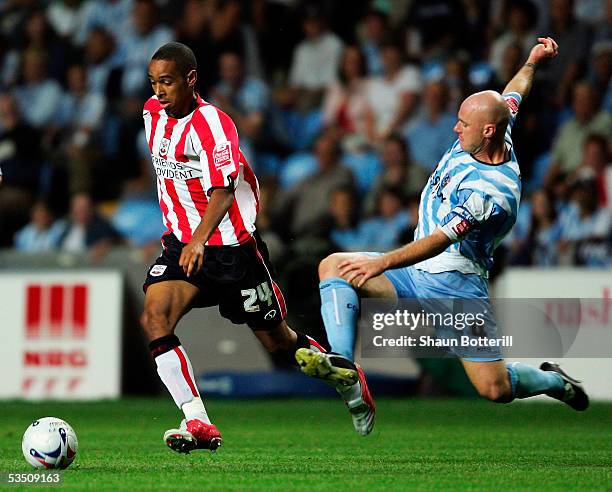 Dexter Blackstock of Southampton is tackled by Robert Page of Coventry City during the Coca-Cola Championship match between Coventry City and...