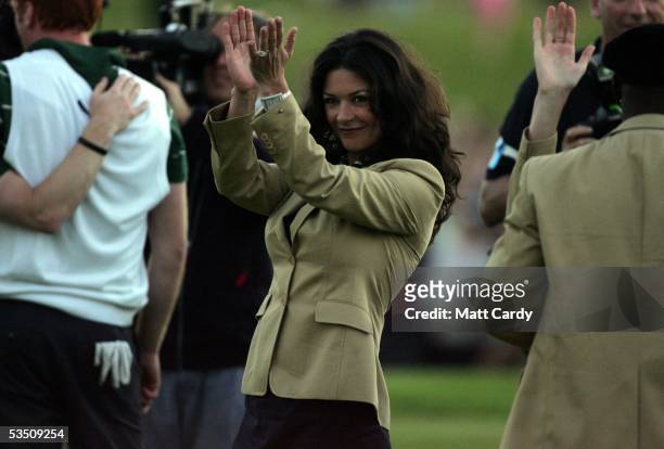 Celebrity golfer Catherine Zeta-Jones applauds her team on the final day of The All-Star Cup Celebrity Golf tournament at the Celtic Manor Resort on...