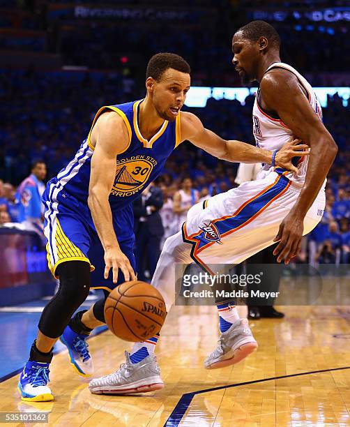 Stephen Curry of the Golden State Warriors drives against Kevin Durant of the Oklahoma City Thunder during the second half in game six of the Western...