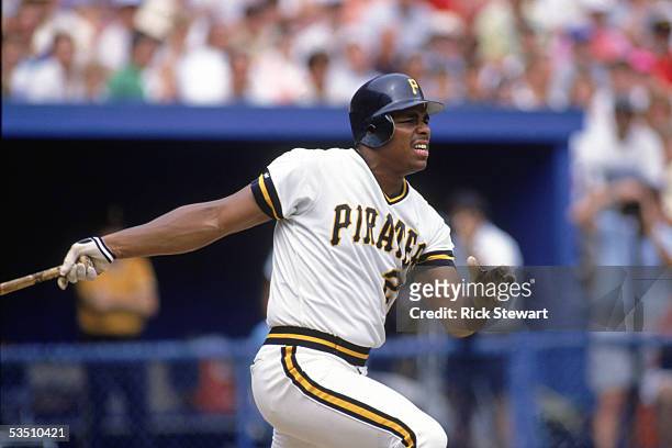 Bobby Bonilla of the Pittsburgh Pirates watches the flight of the ball as he follows through on his swing during a 1990 MLB season game at Three...