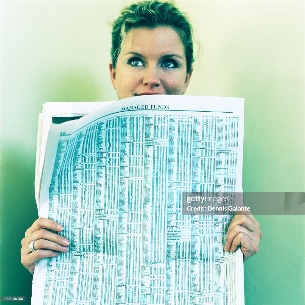 Woman Hiding Behind Newspaper