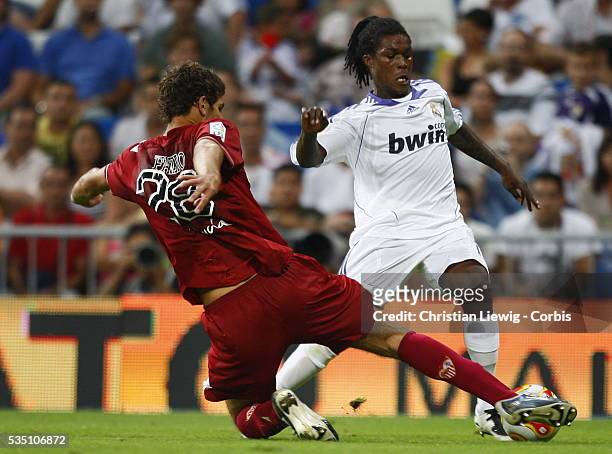Fazio and Drenthe during the second leg of the Spanish SuperCup between Real Madrid and Sevilla FC. | Location: Madrid, Spain.