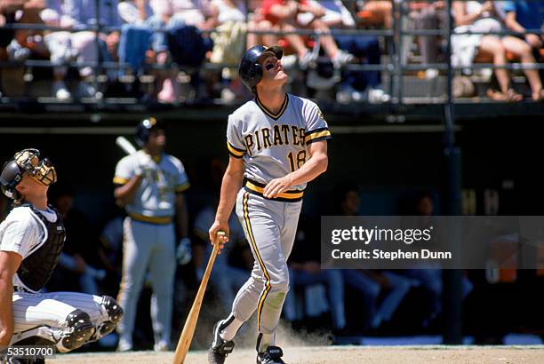 Andy Van Slyke of the Pittsburgh Pirates watches the flight of the ball as he stands at the plate during a game against the San Diego Padres circa...