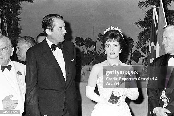 American actor Gregory Peck, Italian director Vittorio de Sica and Italian actress Gina Lollobrigida receiving the David di Donatello Award....