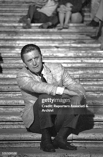 American actor Kirk Douglas taking a break on the set of Two Weeks in Another Town. Rome, 1962