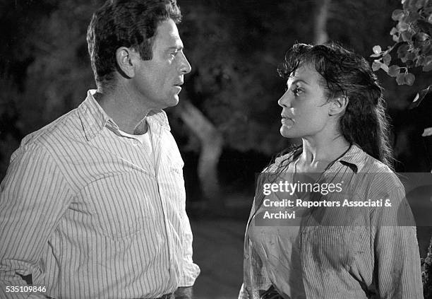 Italian actor Raf Vallone talking to German actress Eva Kotthaus in Uragano sul Po. Italy, 1956