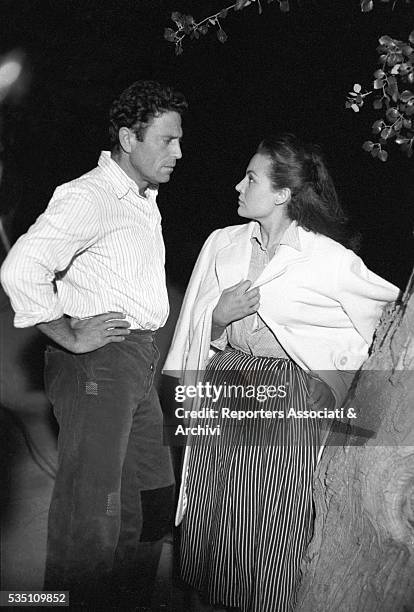 Italian actor Raf Vallone talking to German actress Eva Kotthaus in Uragano sul Po. Italy, 1956