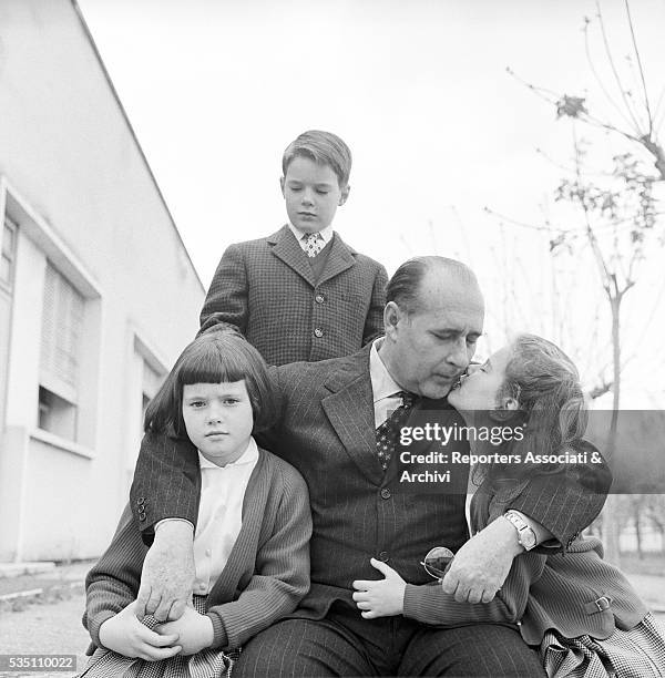 Italian director Roberto Rossellini posing with his children Robertino, Isotta and Isabella. Italy, 1957