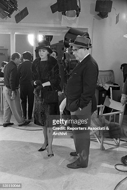 Italian director Roberto Rossellini and Danish actress Annette Stroyberg on the set of the film Black Soul. Italy, 1962