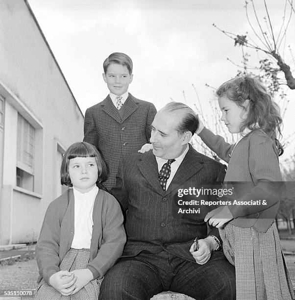 Italian director Roberto Rossellini posing with his children Robertino, Isotta and Isabella. Italy, 1957