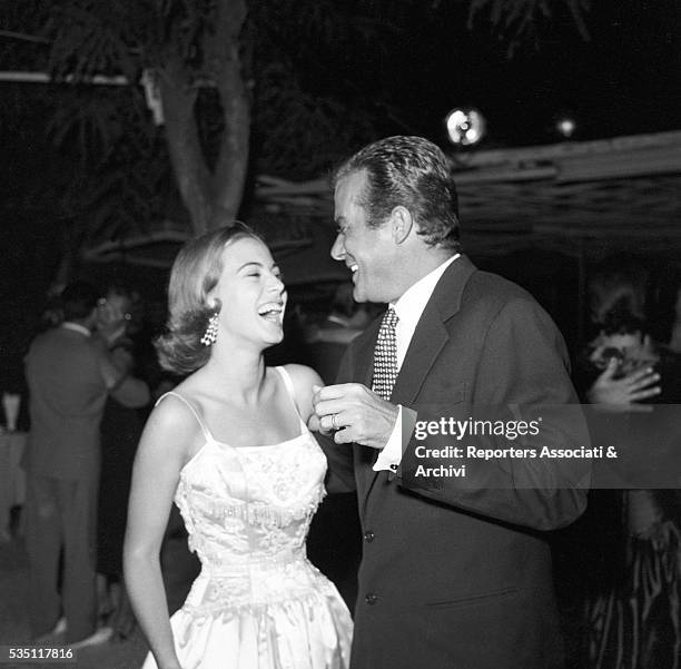 Italian actor Massimo Serato and Italian actress Anna Maria Ferrero dancing during a party at the Belvedere delle Rose. Rome, 25th August 1955