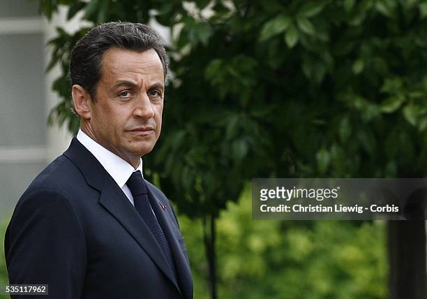 France's new President Nicolas Sarkozy attends an inaugural ceremony with Republican guards in the garden of the Elysee Palace in Paris after the...