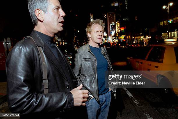 Chef Gordon Ramsay and food writer and chef Anthony Bourdain walk to dinner after viewing the refurbishment at "The London" Ramsey's new restaurant...