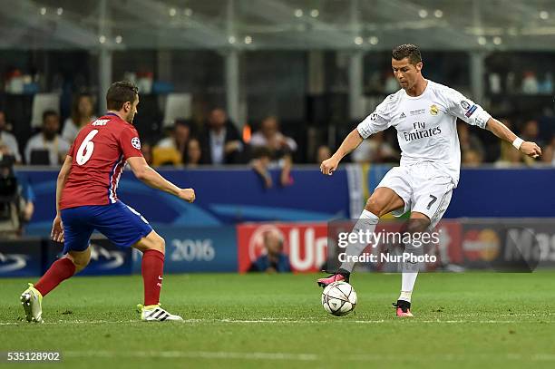 Koke of Atletico Madrid and Cristiano Ronaldo of Real Madrid fight for the ball during the UEFA Champions League Final between Real Madrid and...