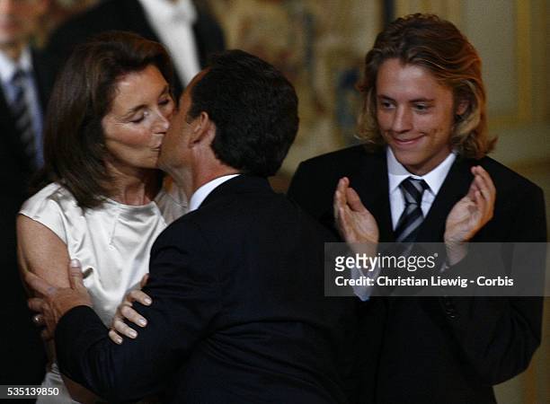 Newly-inaugurated French President Nicolas Sarkozy kisses his wife Cecilia sarkozy in the company of their children at the handover ceremony at the...
