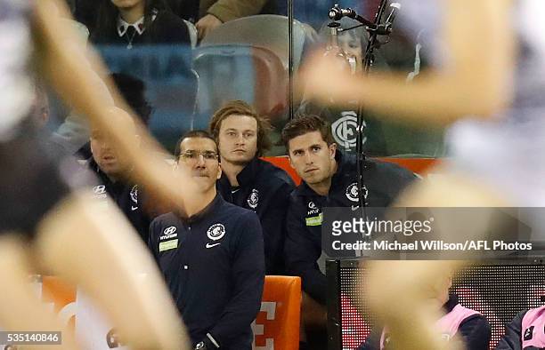 Liam Sumner and Marc Murphy of the Blues look on from the bench during the 2016 AFL Round 10 match between the Carlton Blues and the Geelong Cats at...