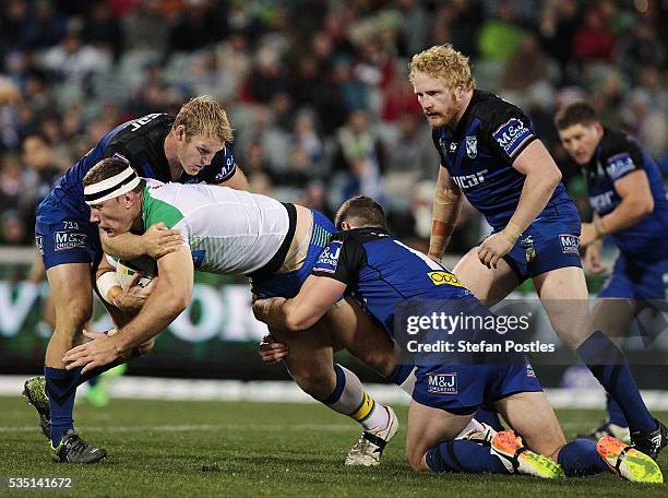 Shannon Boyd of the Raiders is tackled during the round 12 NRL match between the Canberra Raiders and the Canterbury Bulldogs at GIO Stadium on May...