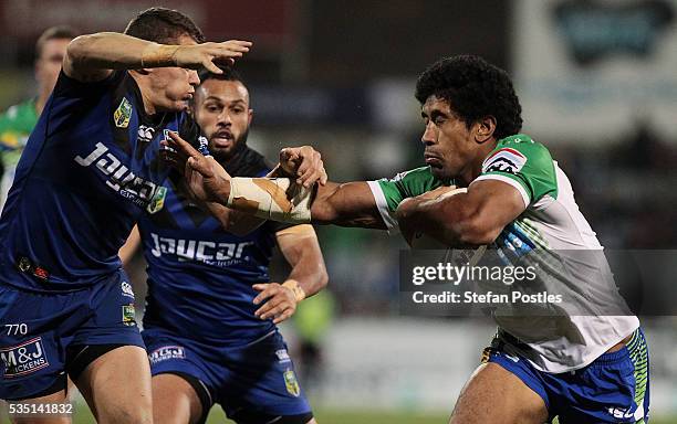 Iosia Soliola of the Raiders is tackled during the round 12 NRL match between the Canberra Raiders and the Canterbury Bulldogs at GIO Stadium on May...