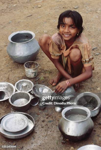 portrait of girl from andra village cleaning utensils. - andra film vintage stock-fotos und bilder