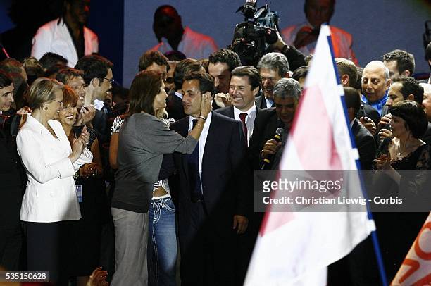 Defense Minister Michelle Alliot-Marie watches as Cecilia Sarkozy kisses her husband, Nicolas Sarkozy at the concert celebrating the victory of...