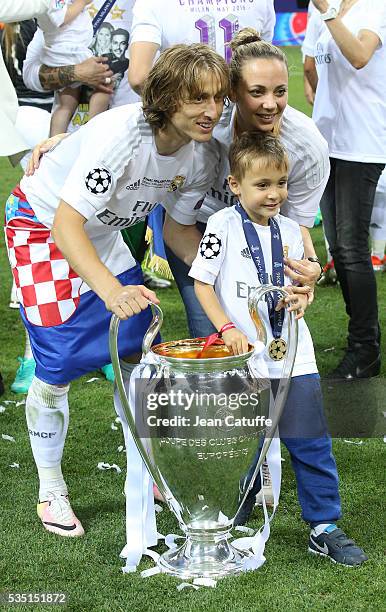 Luka Modric of Real Madrid celebrates with his wife Vanja Bosnic Modric and their son Ivano Modric winning the UEFA Champions League final between...