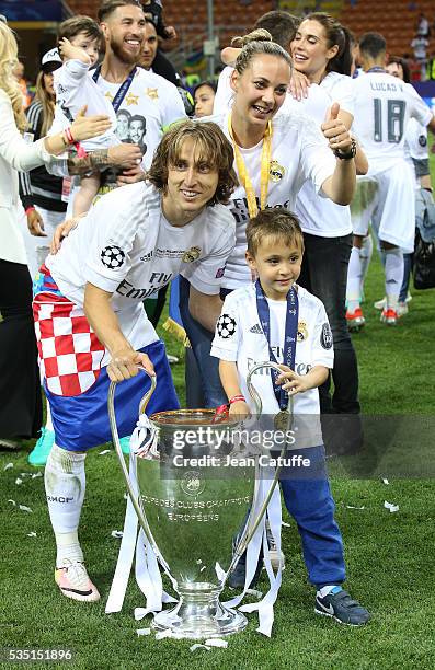 Luka Modric of Real Madrid celebrates with his wife Vanja Bosnic Modric and their son Ivano Modric winning the UEFA Champions League final between...