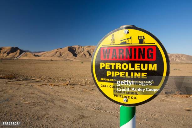 a pipeline near the kern river oilfield in bakersfield, california, usa, in unprecedented drought. - kern river oil field stock pictures, royalty-free photos & images