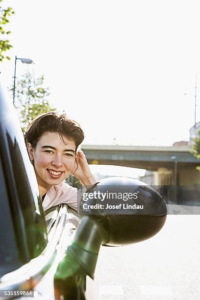 woman driving open-top car - josef lindau stock-fotos und bilder