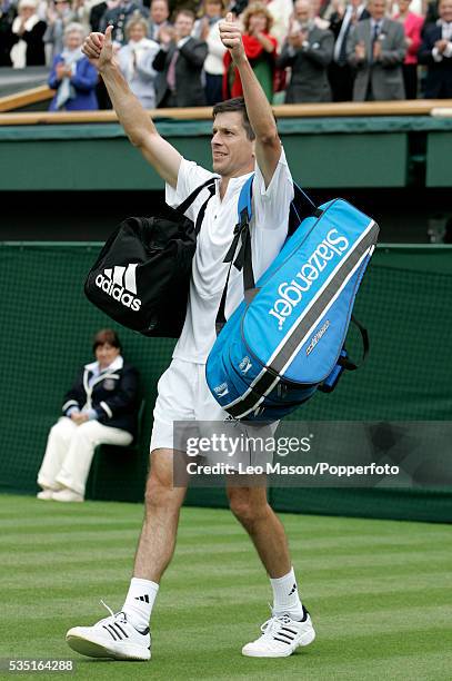 British professional tennis player Tim Henman celebrates after beating Carlos Moya of Spain in the first round of the Men's Singles tournament at the...