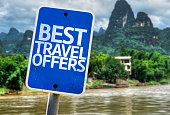 Best Travel Offers sign with a forest background