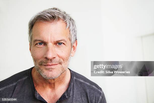 portrait of man looking at view - male blue eyes stock pictures, royalty-free photos & images