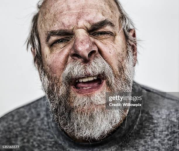 confused senior adult man close-up - mouth talking stock pictures, royalty-free photos & images