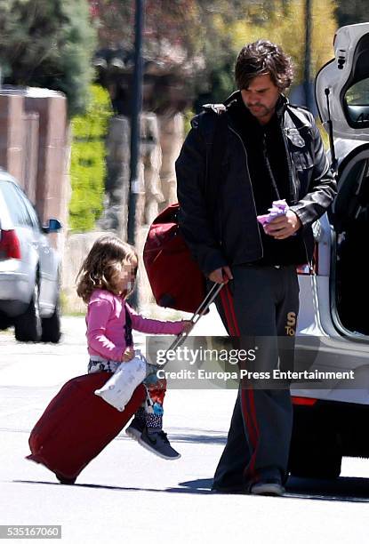 Part of this image has been pixellated to obscure the identity of the child) Antonio de la Rua and his daughter Zulu de la Rua are seen on May 1,...