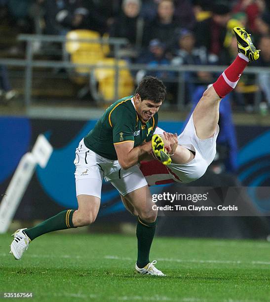 Huw Bennett, Wales, is tackled by Jaque Fourie, South Africa, during the Wales V South Africa, Pool D match during the Rugby World Cup in Wellington,...