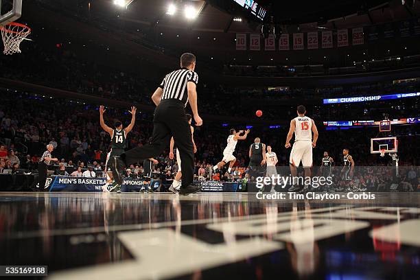 Justin Anderson, Virginia, shoots from long range at the buzzer during the Virginia Cavaliers Vs Michigan State Spartans basketball game during the...