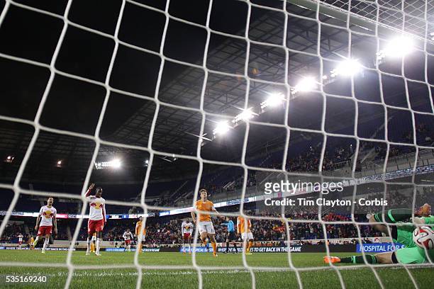 Bradley Wright-Phillips, New York Red Bulls, completes his hat-trick from the penalty spot beating Houston Dynamo goalkeeper Tally Hall during the...